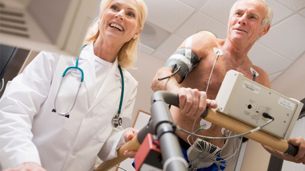 Elderly white man having heart treadmill stress test